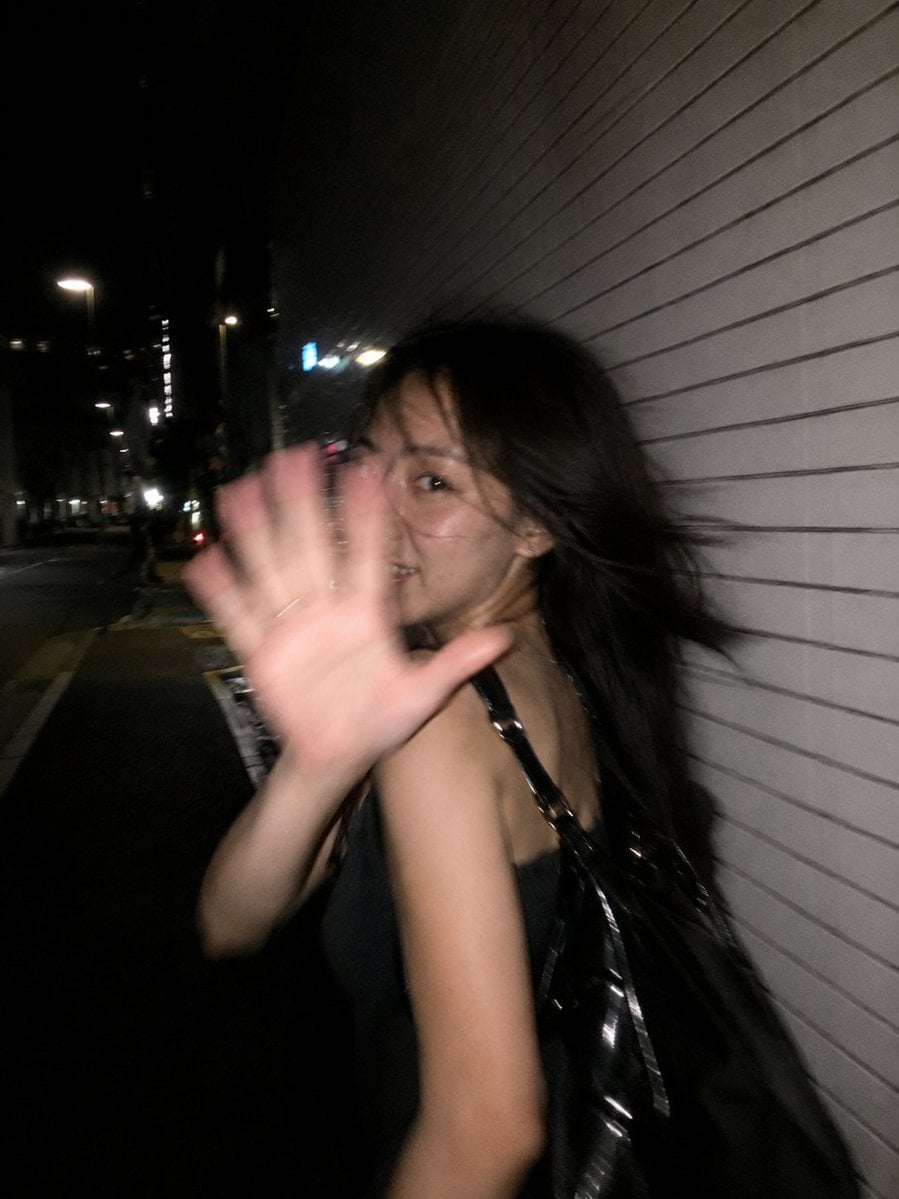 Ultra-realistic candid smartphone flash photograph, portrait