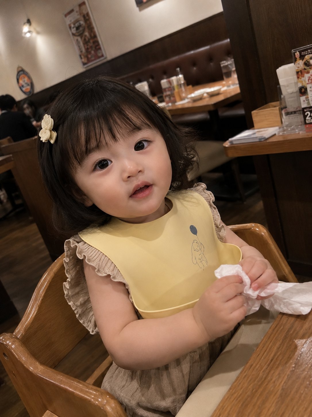 Photorealistic candid smartphone snapshot of an adorable tod