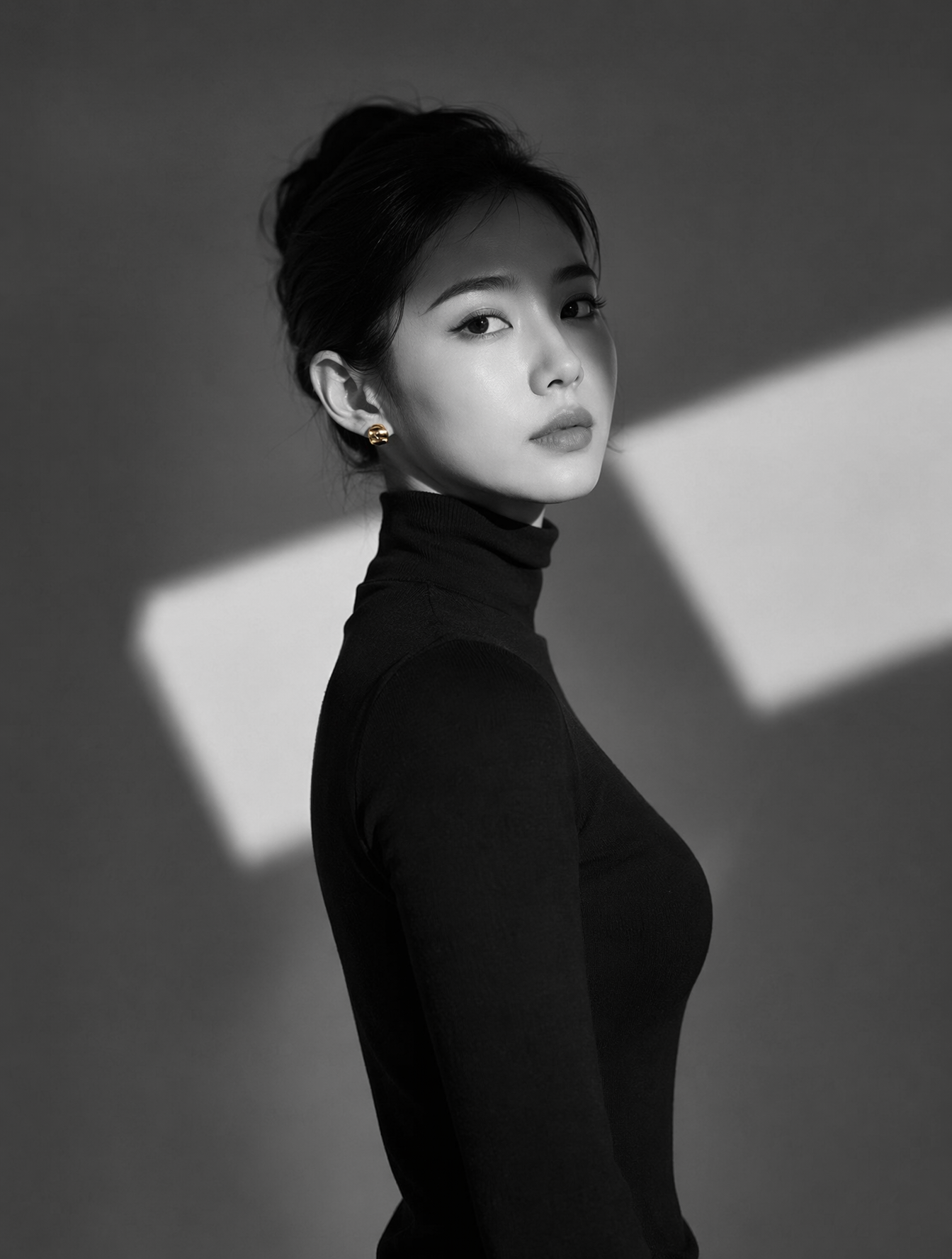 A high-resolution black and white portrait of a woman wearin