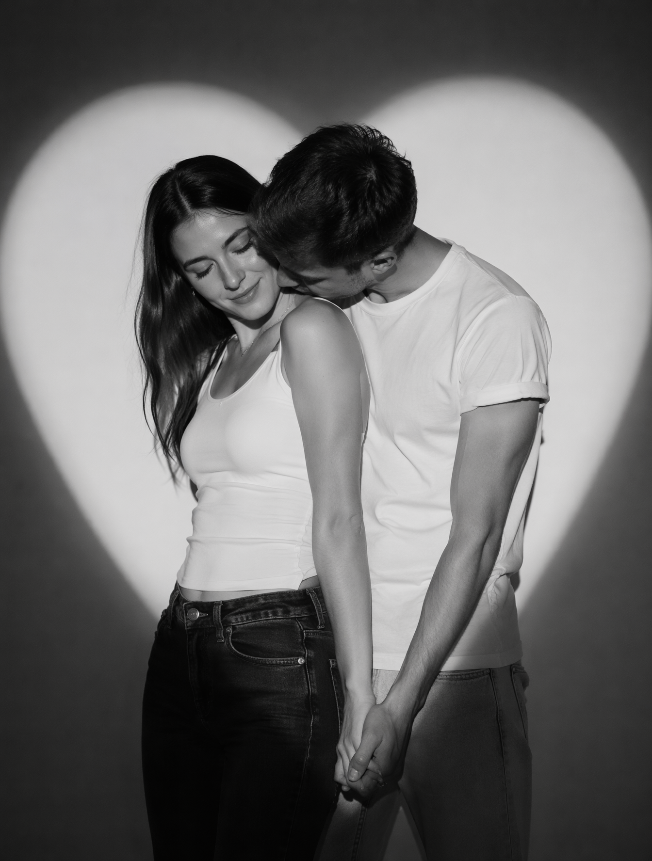 Create a romantic black-and-white studio portrait of a real
