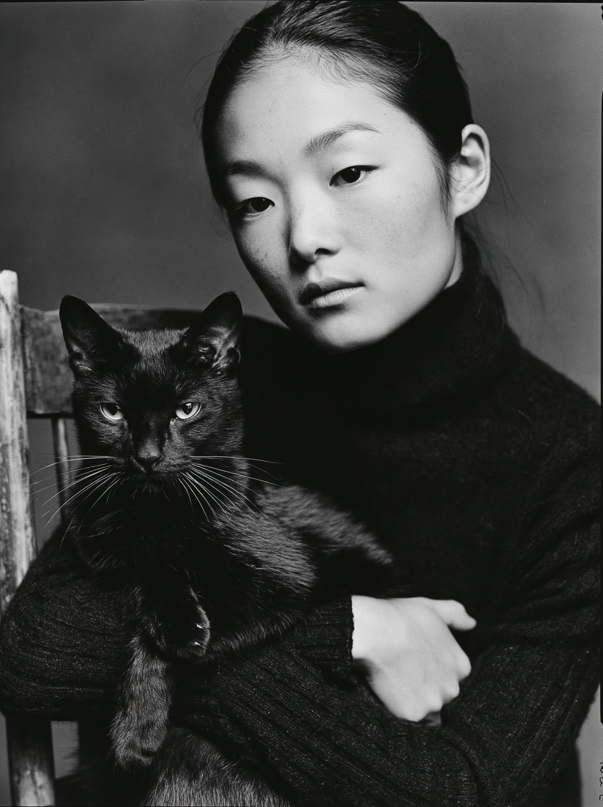 Fine art black and white portrait, woman seated in a vintage